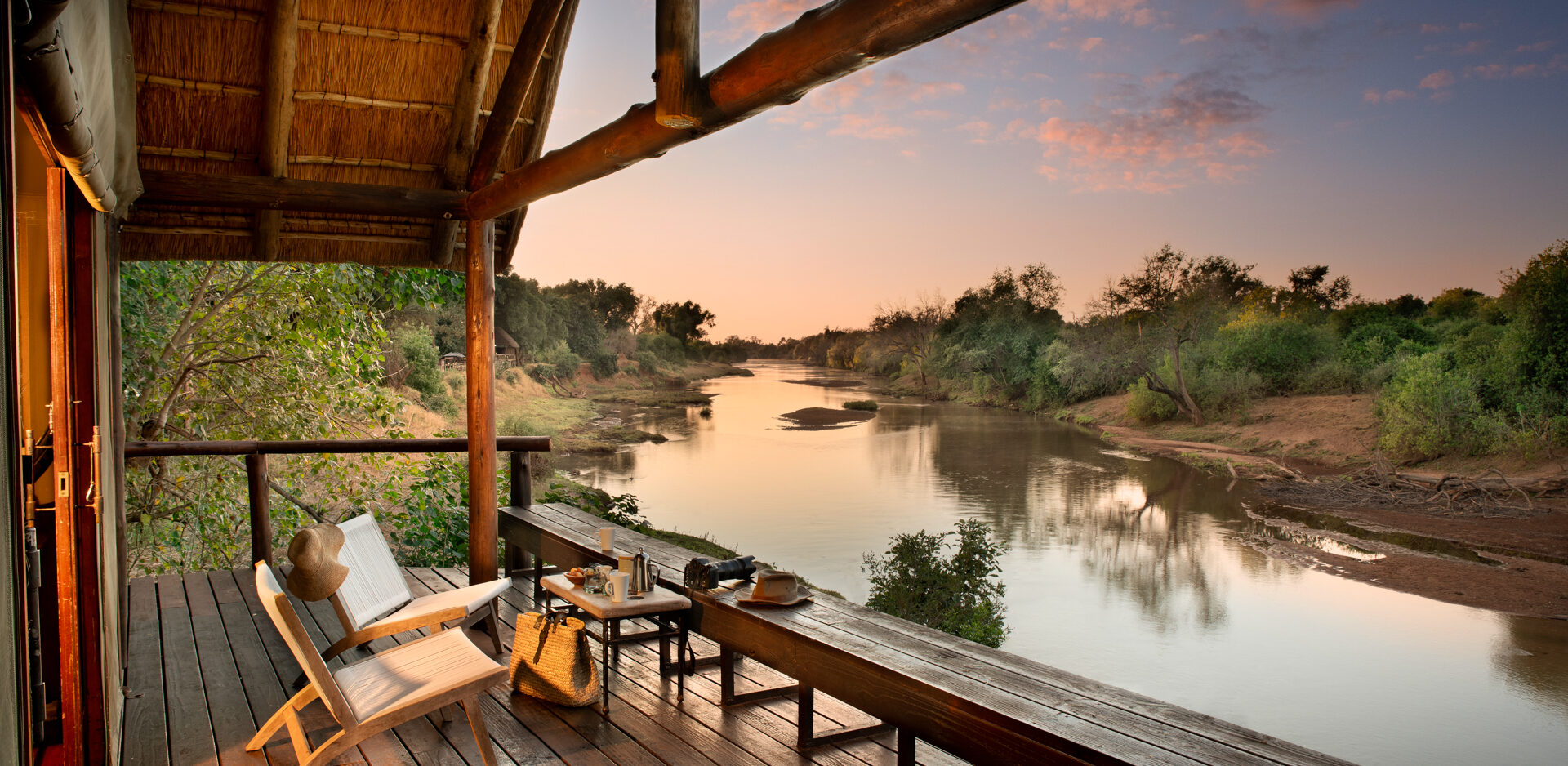 RETURN AFRICA’S 2025: GROWTH, CONNECTION, AND SLOW JOURNEYS 1 | RETURN Africa rivate deck of a Pafuri Camp Riverview Tent overlooking the Luvuvhu River at sunrise