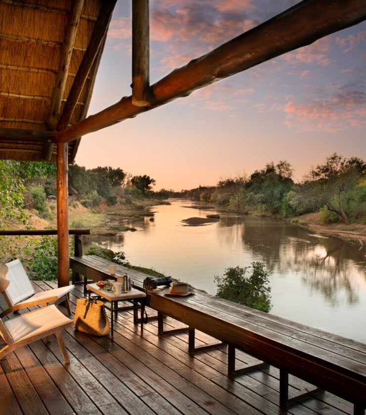 rivate deck of a Pafuri Camp Riverview Tent overlooking the Luvuvhu River at sunrise