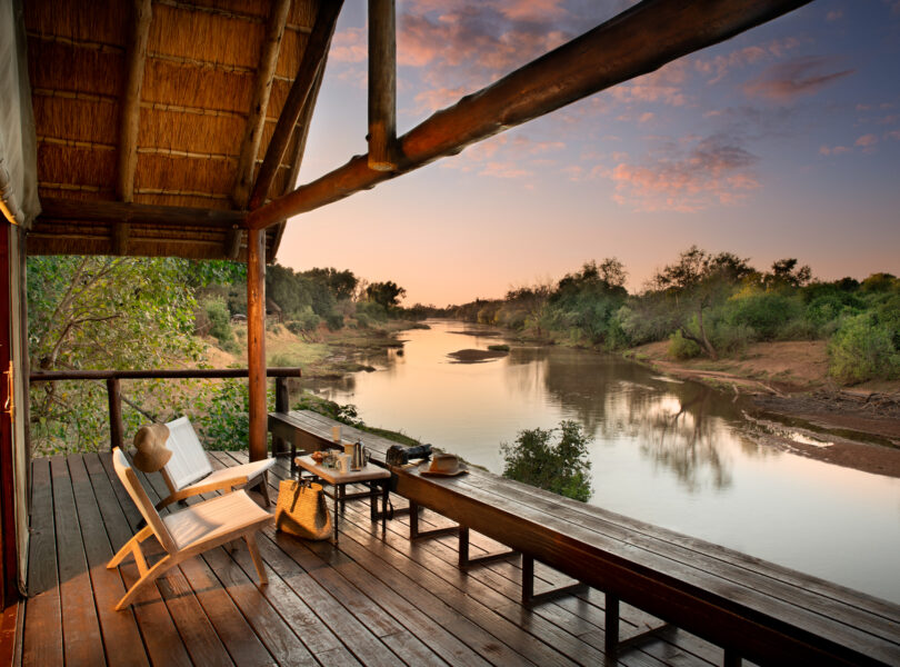 RETURN AFRICA’S 2025: GROWTH, CONNECTION, AND SLOW JOURNEYS 13 | RETURN Africa rivate deck of a Pafuri Camp Riverview Tent overlooking the Luvuvhu River at sunrise