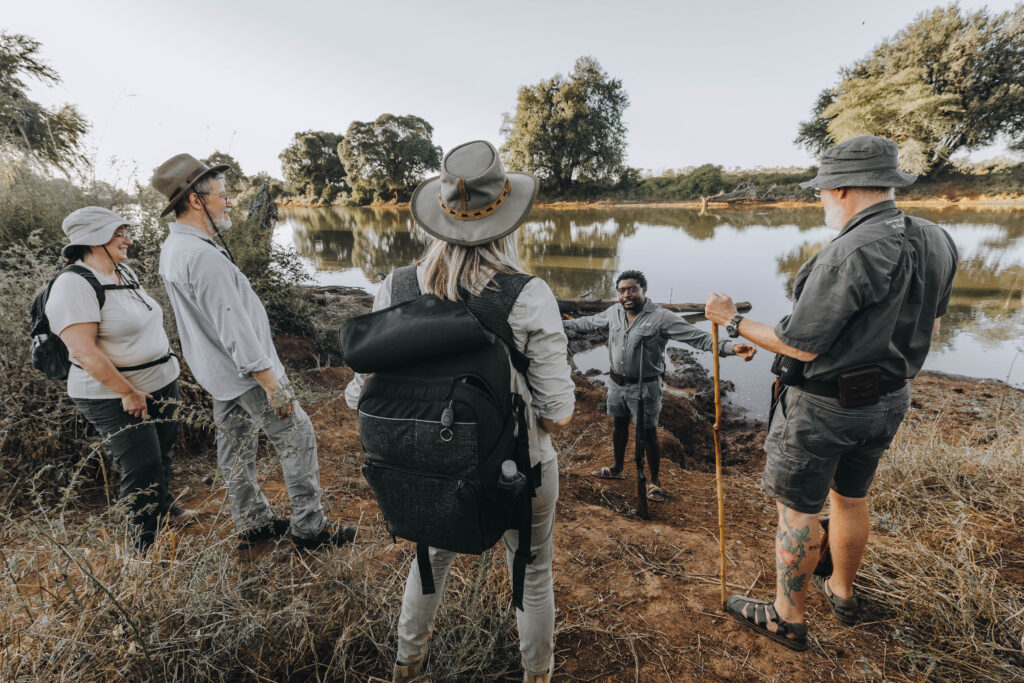 RETURN Africa walking safari guide briefing guests at Pafuri walking camp before morning walk